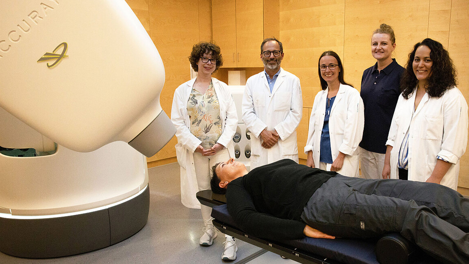 Photo of radiosurgery staff in front of the CyberKnife